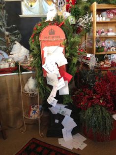 a christmas display in a store filled with lots of holiday decorations and papers on the floor