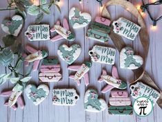 some decorated cookies are laying on a table