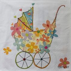 a baby stroller with flowers on it is shown in this handmade paper napkin