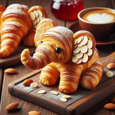 an elephant figurine sitting on top of a cutting board next to some bread