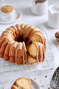 a bundt cake with icing sitting on a cooling rack