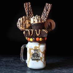 a chocolate cake in a mug with candy on top