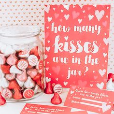 valentine's day candy in a jar next to a card