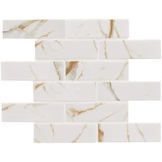 white marble tile with gold veining on the edges and one side is shown in three different colors