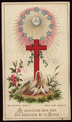 a cross with two doves and flowers on it