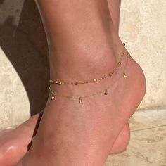 For an elegant and classic look. This anklet has the perfect combination of dainty and sparkle. 14K Gold over .925 Sterling Silver Cubic Zirconia, 3mm Hypoallergenic, lead and nickel free Length 9.5-11.5in(24-29cm) Spring clasp closure #ANK010 Elegant Adjustable Tarnish-resistant Anklets, Dainty Adjustable Tarnish-resistant Anklets, Elegant Adjustable Tarnish Resistant Anklets, Adjustable Elegant Dangle Anklets, Elegant Adjustable Dangle Anklets, Elegant Hypoallergenic Gold Anklets, Elegant Gold Dangle Anklets, Elegant Cubic Zirconia Anklets, Jewelry Bridal