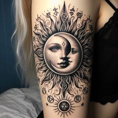 a woman's leg with a sun and moon tattoo on it, in black and white