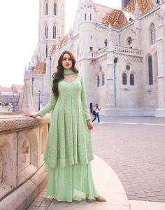 Mint green flared top with palazzo and dupatta Elegant Green Palazzo Set For Festive Occasions, Elegant Green Festive Palazzo Set, Elegant Green Palazzo Set With Sheer Dupatta, Green Palazzo Set With Dupatta, Designer Green Palazzo Set With Dupatta, Elegant Green Sharara For Eid, Elegant Green Sharara With Dabka, Elegant Green Sharara With Dabka Detailing, Elegant Semi-stitched Green Palazzo Set