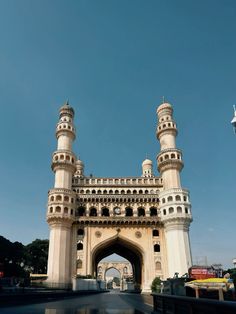 a tall white building with two towers on top