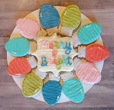 a birthday cake decorated with colorful frosting on a plate