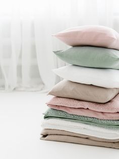 a stack of pillows sitting on top of each other