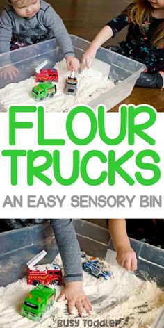 two children playing with flour and trucks in a bin