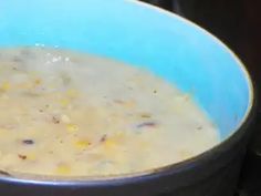 a bowl filled with soup sitting on top of a stove