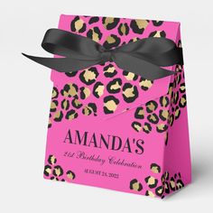 a pink leopard print birthday party bag with black ribbon and name on the front side