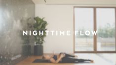 a woman laying on top of a wooden floor next to a window with the words night time flow