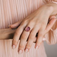 Feel nature's soothing touch of love by wearing a natural rose quartz gemstone on your finger. Our pink quartz ring is adjustable, affordable, and made with high-quality sterling silver. Wear the oval rose quartz ring to bring more serenity for everyday moments. The rose quartz stone ring also works well with the heart chakra and enhances romance through its pink essence and vintage look. Adjustable Rose Quartz Rose Gold Ring, Rose Gold Oval Moonstone Ring, Oval Rose Gold Moonstone Ring, Elegant Pink Oval Cabochon Ring, Elegant Pink Rose Quartz Crystal Ring, Elegant Oval Rose Quartz Rings, Pink Quartz Ring, Pretty Roses, Rose Quartz Ring