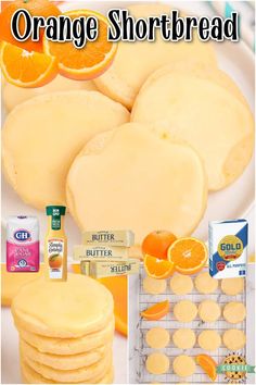 orange shortbread cookies are arranged on a plate with butter and orange slices next to them