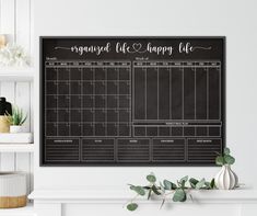 a black and white calendar hanging on the wall