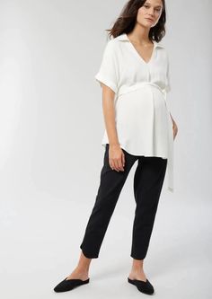 This deep-V woven (maternity) top pulls double pregnancy duty: Wear it with a blazer and heels for work, or throw it on with jeans and sneakers for a warm-weather weekend look. The cuffed kimono sleeves are totally flattering and you can adjust the removable tie waist to accentuate your bump (or not!) at any size. OEKO-TEX® STANDARD 100 approved! Every item used for this style (every thread, button, zipper, or clasp) has been found to be harmless for you, and for baby. The strict criteria okeo-t Maternity Work Pants, 28 Weeks Pregnant, Maternity Work Wear, Maternity Work Clothes, Tie Waist Shirt, Tie Waist Top, Cute Maternity Outfits, Maternity Shirt, Pregnancy Stages