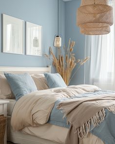 a bedroom with blue walls and white bedding, wicker basket hanging from the ceiling