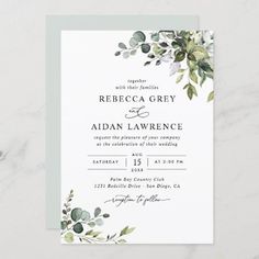 an elegant wedding card with greenery on the front and bottom, in white paper