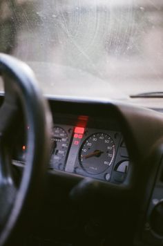 the dashboard of a car with a speedometer and gauges on it's dash