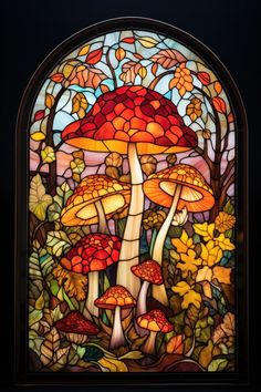 a stained glass window with mushrooms and leaves