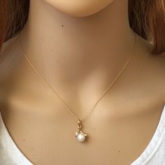 Description: 14k Solid Gold Mini Pearl Pendant Dainty Necklace - Minimalist Item No.: Pw12/6814 Metal Type: 14k Solid Gold Metal Color: Yellow Gold. Stones: Pearl And Cubic Zirconia Measurement: 16"-19" Adjustable Length Chain. Pendant: Pearl: 5 Mm Est. Total Weight: 2.01 Grams (1.1 Pendant + 0.91 Chain) Note: Matching Earrings Are Available For Sale In Another Listing. Luxury 14k Yellow Gold Pearl Necklace, Elegant 14k Gold Pearl Necklace, Timeless Yellow Gold Pearl Necklace For Anniversary, 14k Gold Delicate Chain Pearl Necklace For Weddings, Classic Gold-plated Yellow Gold Pearl Necklace, Elegant Gold Plated Yellow Gold Pearl Necklace, Elegant 14k Gold Pearl Necklace In Gold, Elegant 14k Gold Jewelry With Pearl Charm, Classic Yellow Gold Plated Pearl Necklace