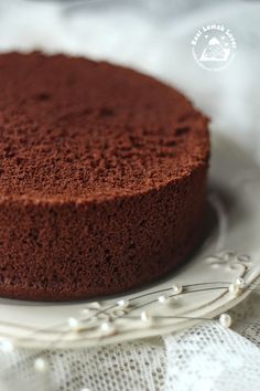 a chocolate cake sitting on top of a white plate