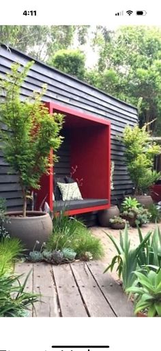 an outdoor living area with plants and potted trees