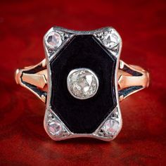 A striking Art Deco ring crowned with a glistening old mine cut diamond bezel set in the centre of a jet-black onyx base. The centre stone contrasts beautifully against the backdrop and weighs approx. 0.20ct, with four additional rose cut diamonds in each corner (approx. 0.36ct total).   Diamonds are truly a stone of perfection, desired for their rarity, durability and exceptional sparkle that is second to none. Their superior qualities have made them the ultimate symbol of love across the ages Elegant Enamel Ring With Bezel Setting For Anniversary, Elegant Black Diamond Ring For Evening, Black Victorian Ring With Black Enamel, Black Victorian Rings With Black Enamel, Luxury Black Onyx Diamond Ring, Black Oval Enamel Ring, Black Oval Enamel Ring For Formal Occasions, Formal Black Oval Enamel Ring, Antique Black Enamel Rings