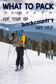 a group of people hiking up the side of a snow covered slope with skis