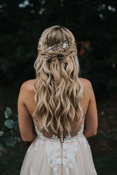 a woman with long blonde hair wearing a wedding dress