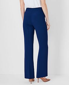 Elevate your wardrobe with the Petite Side Zip Trouser Pant in Fluid Crepe by Ann Taylor, a testament to timeless elegance and comfort. These pants are meticulously designed to enhance your silhouette, featuring a high-rise fit that sits just below the natural waist and a flattering trouser leg with a gentle flare to elongate your legs.

- **Size:** Petite 12
- **Color:** Pure Sapphire
- **Material:** 95% Polyester, 5% Spandex
- **Fit:** Tailored and fitted
- **Length:** Full length; 29" inseam Elegant Pants With Zipper Closure For Fall, Elegant Straight Pants With Zipper Closure, Fitted Wide-leg Bottoms, Fitted Office Bottoms With Side Zipper, Elegant Office Bottoms With Side Zipper, Elegant Formal Bottoms With Zipper Closure, Wide Leg Workwear Bottoms With Zip Fly, Elegant Straight Leg Bottoms With Zipper Closure, Wide Leg Bottoms For Workwear With Zip Fly