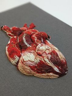 a piece of art that looks like a human heart