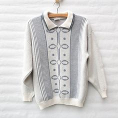 This is a lovely, knit sweater in white and grey knit design with double collar. Warm and cozy, perfect with your favourite jeans and comfy skirts.Made from 85% Acrylic and 15% Nylon.Size labeled: MediumMeasurements when laid flat are:Bust: 53cmWaistband: 39cmLength: 63cmSleeve Length: 49cmcAlthough the label is nearly washed out, the jumper itself is in an excellent condition. White Collared Knit Sweater, White Cable Knit Long Sleeve Polo Sweater, White Winter Polo Sweater With Ribbed Collar, White Knit Polo Sweater, White Ribbed Collar Polo Sweater For Winter, White Polo Sweater With Ribbed Collar For Winter, Cozy White Sweater With Ribbed Collar, Classic White Jacquard Knit Sweater, Cozy White Polo Sweater For Winter