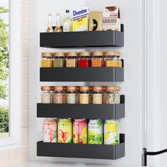 an organized spice rack in the kitchen with spices and condiments on it's shelves