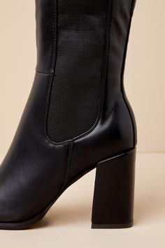 Every look you create with the Thia Black Square Toe Knee-High Boots will be worth everyone's attention! Sleek faux leather shapes these perfectly chic boots that feature a trendy square-toe upper that rises to a 13.5"" knee-high shaft with an elastic gusset along the outstep, a 15.25"" zipper at the instep, and a convenient pull tag at the bag. 14"" circumference. A sturdy block heel completes the stylish design! Available in whole sizes only. 3. 25" wrapped block heel. Lightly cushioned insole Trendy Faux Leather Heeled Boots With Reinforced Heel, Trendy Faux Leather Heeled Boots With Block Heel, Trendy Faux Leather Boots With Block Heel, Chic Fitted Chelsea Boots With Square Toe, Trendy Formal Heeled Boots In Faux Leather, Trendy Formal Faux Leather Heeled Boots, Chic Ankle Boots In Polyurethane, Trendy Faux Leather Mid-calf Boots, Chic Polyurethane Ankle Boots