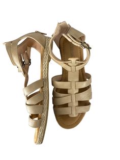 Brand: CLOTHES MENTOR Style: SANDALS FLATS Color: TAN Size: 6 Other Info: SHIBEVER - SIZE 36 SKU: 186-186278-19482 CONDITION: GENTLY USED Casual T-strap Sandals With Buckle For Vacation, Casual T-strap Sandals With Buckle Closure For Vacation, Casual Synthetic T-strap Sandals For Beach, Beige T-strap Sandals With Round Toe For Beach, Beige Round Toe T-strap Sandals For Beach, Beige T-strap Sandals For Summer Beach, Beige T-strap Sandals For The Beach, Beige T-strap Sandals With Round Toe For Vacation, Beige T-strap Sandals For Vacation