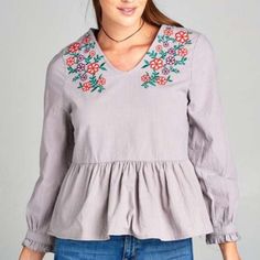 Lavender Floral Embroidered Blouse With Longsleeves, A Ruffled Hem Color: Lavender Material: 100% Cotton Fit: True To Size Casual Purple Blouse With Floral Embroidery, Purple Floral Embroidered Top For Fall, Purple Floral Embroidery Top For Fall, Casual Embroidered Purple Blouse, Casual Purple Embroidered Blouse, Spring Purple Embroidered Cotton Top, Spring Cotton Embroidered Sleeve Top, Spring Embroidered Long Sleeve Top With Ruffles, Lavender Long Sleeve Cotton Top