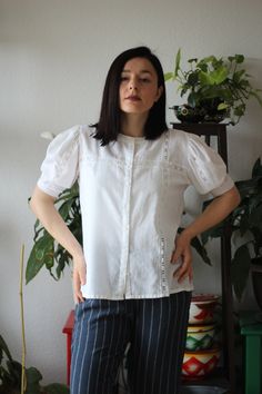 Vintage 80s puff sleeve embroidered collarless blouse Weight 130 grams Size M Shown on model M size 165 cm tall wearable for S and M depending on desired fit Measurements: whole length 65 cm shoulder to shoulder without sleeve 37 cm armpit to armpit 50 cm sleeves 35 cm Excellent vintage condition Short Sleeve Embroidered Shirt For Work, Casual Pintuck Short Sleeve Tops, Casual Short Sleeve Tops With Pintucks, Short Sleeve Tops With Pintucks For Daywear, Embroidered Short Sleeve Workwear Blouse, Workwear Embroidered Short Sleeve Blouse, Fitted Crew Neck Blouse With Buttons, Fitted Broderie Anglaise Short Sleeve Top, Fitted Short Sleeve Top With Broderie Anglaise