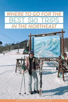 a woman standing in the snow with skis and poles next to a sign that says where to go for the best ski trips in the north east