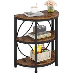 a round wooden table with shelves and baskets on the bottom, next to a vase filled with flowers