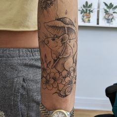 a person with a tattoo on their arm