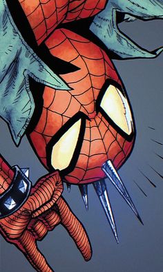 a spider - man with claws on his face holding a cell phone in one hand