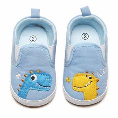 Baby Girls Dinosaur Slip On Canvas Sneakers - PrettyKid Blue Non-slip Booties For Playtime, Casual Blue Booties For Playtime, Blue Non-slip Round Toe Booties, Casual Blue Booties With Soft Sole, Cute Blue Non-slip Sneakers, Casual Spring Booties For Playtime, Casual Spring Booties For Outdoor Play, Cute Non-slip Sneakers For Playtime, Playful Summer Sneakers For Playtime