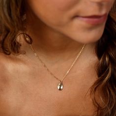 With a hammered oval charm pendant on our Narrow Links chain, the Olivia Necklace adds a touch of whimsy to any outfit. Want to create a set?! Pair this piece with our bestselling Olivia Ring! DETAILSPendant measures at 0.8"Available in 14", 16", or 18"Available in 14k Gold FillHypoallergenic, Nickel-Free, and Water Safe Dainty Oval Charm Necklaces, Dainty Oval Charms Necklaces, Everyday Oval Pendant Necklace With Charms, Dainty Oval Necklaces With Charms, Everyday Delicate Oval Chain Jewelry, Minimalist Oval Pendant Jewelry With Charms, Minimalist Oval Pendant Charms Jewelry, Everyday 14k Gold Oval Pendant Charm Necklace, Everyday Oval Pendant Charm Necklace Tarnish Resistant