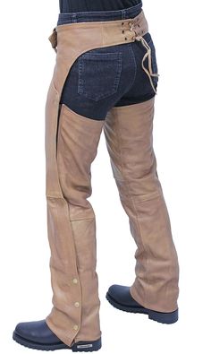 Women's Arizona brown leather chaps with deep pant style pockets. These brown chaps are not only great looking and sexier than those classic unisex chap styles but it's made with a soft antique finish on lambskin leather. Women's biker chaps with an adjustable front belt, soft nylon lining, wind flaps cover leg zippers, a four snap bottom so it can be easily cut to length, and made of a soft lambskin leather. Layered with a pair of jeans to give you the protection you need when you ride. Sizes: XS, S, M, L, XL, 2X, 3X, 4X, 5X. +$10 for 2X-3X, +$20 for 4X-5X. [5#] two deep pants style pockets adjustable buckle up front leather laced back belt for added adjustment side zipper wind flaps hides zippers YKK quality zippers snap cuffs makes it easy to trim to length soft nylon lining top grain l Winter Leather Pants With Belt Loops, Fitted Western Brown Bottoms, Western Style Brown Bottoms For Fall, Fitted Brown Western Bottoms, Western Style Bottoms With Belt Loops For Fall, Brown Full-length Leather Pants With Pockets, Western Full-length Fall Bottoms, Brown Full Length Leather Pants With Pockets, Full Length Brown Leather Pants With Pockets