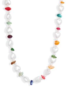 Bright, multicolored imitation stones further the breezy attitude of this adjustable necklace made from organically shaped imitation pearls. 16" length; 3" extender Lobster clasp closure Acrylic/stainless steel/goldtone plate with acrylic imitation pearl Imported Rainbow Pearl, Oval Stud Earrings, Pearl Choker Necklace, White Rainbow, Station Necklace, Pearl Choker, Adjustable Necklace, Keep Jewelry, Boho Jewelry