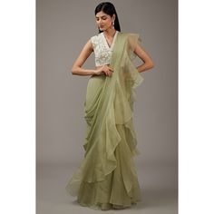 A ruffled saree in organza paired with an embellished handwork beads blouse is a stunning ensemble that beautifully combines traditional and contemporary elements. Ruffled Saree in Organza - Fabric: Organza is known for its lightweight, sheer, and slightly stiff texture, giving the saree a voluminous and graceful fall.  - Design: The ruffled edges add a modern twist to the traditional saree. The ruffles create a cascading effect that enhances the saree's elegance and gives it a playful, feminine look. - Color and Pattern: Organza sarees often come in pastel shades or vibrant colors. They can be plain or have delicate prints or embroidery, which complement the ruffles.  Embellished Handwork Beads Blouse - Fabric: The blouse can be made from Organza or any fabric that complements the organza Ruffled Saree, Dewy Makeup Look, Bold Lip Color, Net Blouses, Drape Saree, Traditional Saree, Organza Sarees, Beaded Blouse, Organza Saree